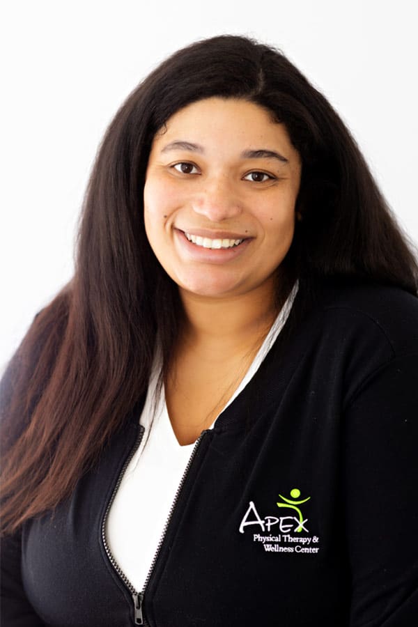 Professional and friendly staff member Beth Prashek smiling for a portrait at Apex Physical Therapy & Wellness Center.