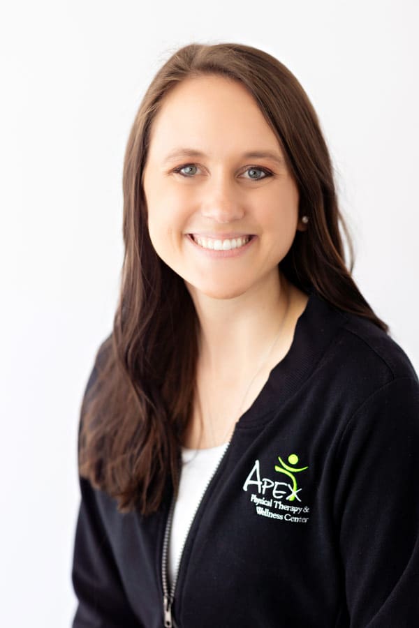 A professional headshot of Rachel Failing, a smiling woman with long hair wearing a black jacket with an "Apex Physical Therapy & Wellness Center" logo.